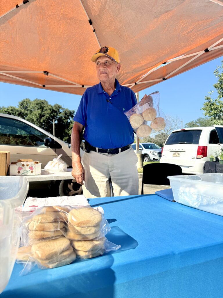 Rev. Dillard holds up a bag of his famous teacakes.