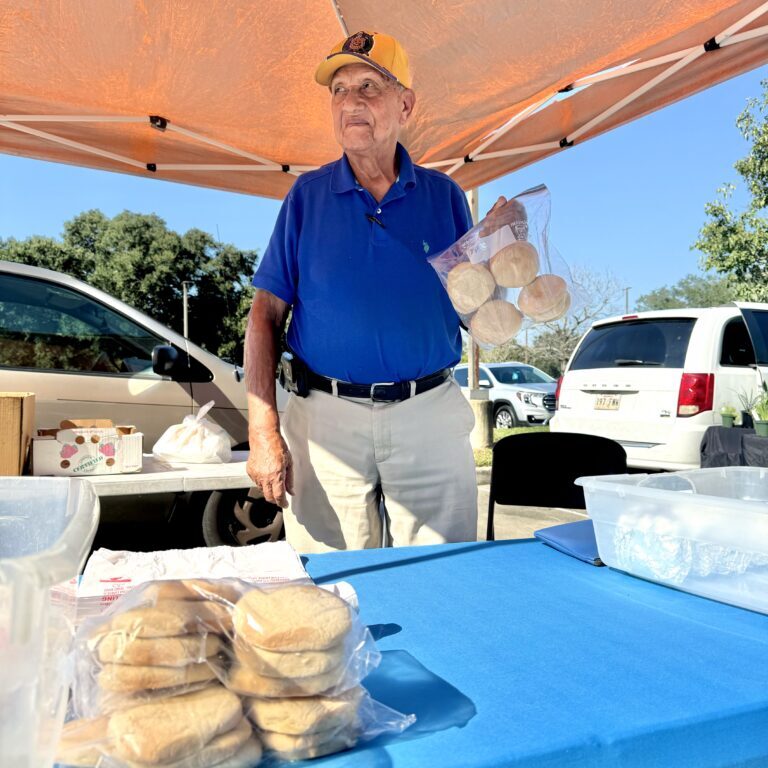 Rev. Dillard holds up a bag of his famous teacakes.